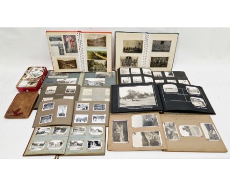 Collection of 12 photograph and postcard albums&nbsp;plus a tin of loose photographs, dating from the early 20th century to m