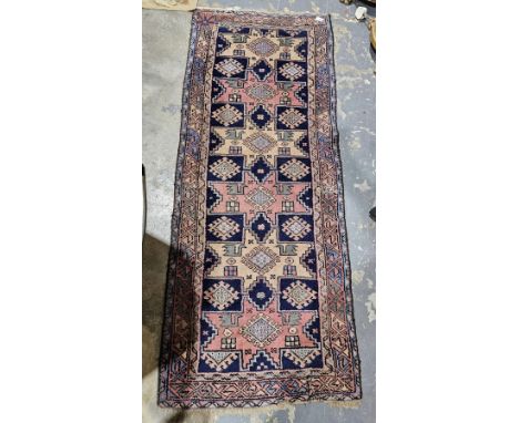 Midnight blue ground runner with hooked lozenge, stylised bird and geometric shape pattern, multiple geometric borders, 174cm