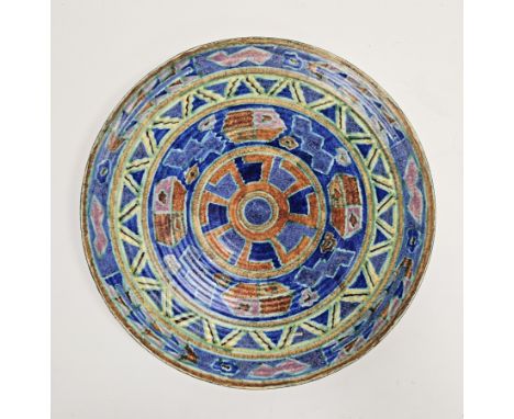 English pottery Art Deco charger, probably by Charlotte Rhead, indistinct blue marks to reverse, boldly painted with stylised