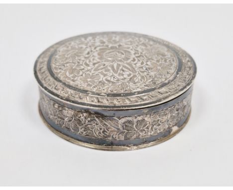 Middle eastern 840 grade silver trinket box, of circular form with lift-off lid, with chased floral decoration to lid and sid