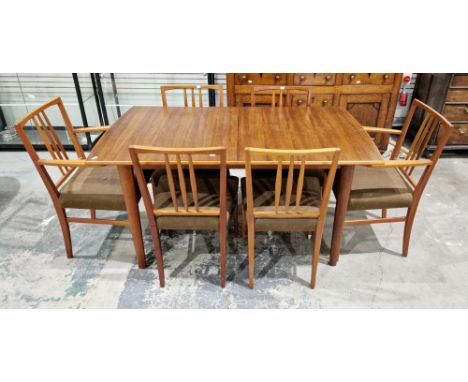 Mid-century Gordon Russell walnut and teak extending dining table&nbsp;with six dining chairs, the table extending with an ad
