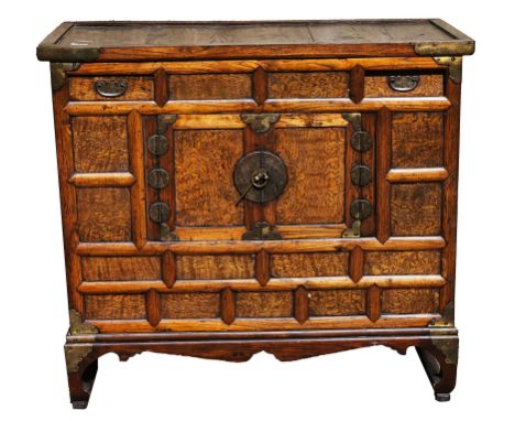 Chinese hardwood chest having two short drawers with brass loop handles above pair small frame panel cupboard doors, all with