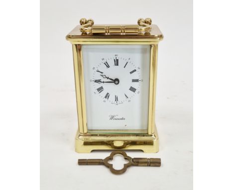 English made gilt-metal carriage clock&nbsp;by Worcester, the case with swing handle and bevel edged glass panels, the dial w