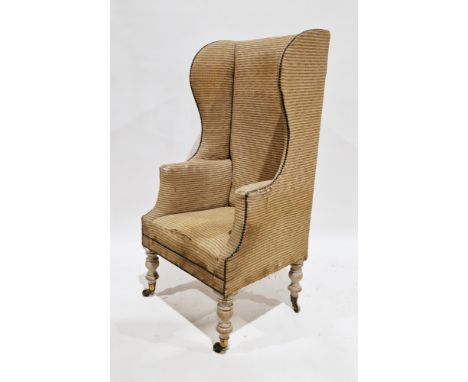 Georgian high wing-back fireside armchair with studded upholstery, on four tall turned baluster legs and castors, 134cm high 