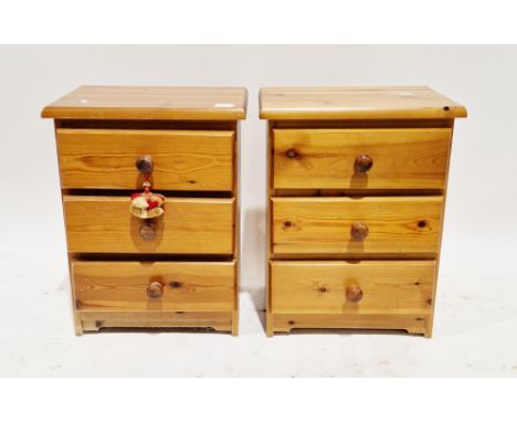 Pair of modern bedside chests of three drawers with pine knob handles, 59cm high x 45cm wide x 35cm deep (2)&nbsp;