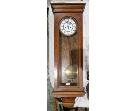 19th century walnut cased Vienna-style eight-day hanging wall clock, the glazed door opening to a gilt and white enamel dial,