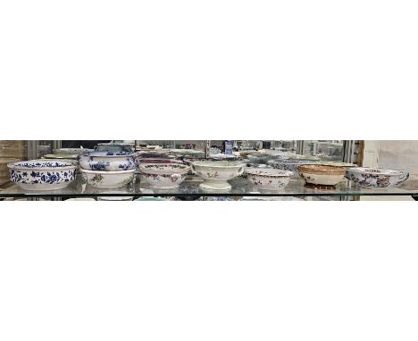 Collection of English pottery and French porcelain sponge dishes and pierced liners, 19th century and later, various printed 