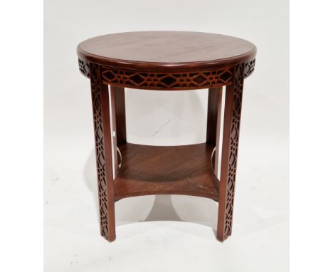 Chinese-style hardwood circular side table with blind fretwork carving to apron and legs, the rectangular legs united by a sh