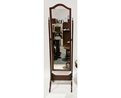 Early 20th century mahogany framed cheval mirror with domed top, the supports with carved finials, 157cm high x 44cm wide x 3