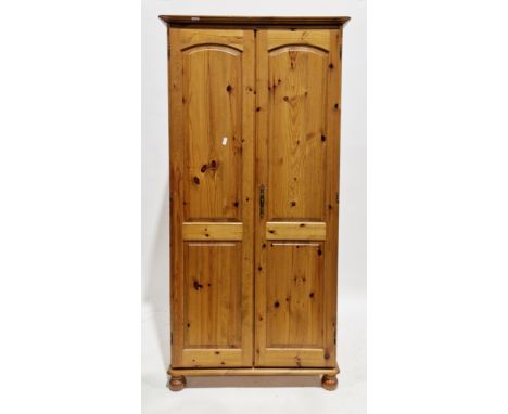 Modern pine wardrobe with double panel doors, on ball feet, 190cm high x 92cm wide x 55cm deep&nbsp;