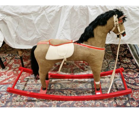 Mid-century rocking horse, the brown fabric covered horse with leatherette bridle and saddle, on a red painted bow rocker, 78
