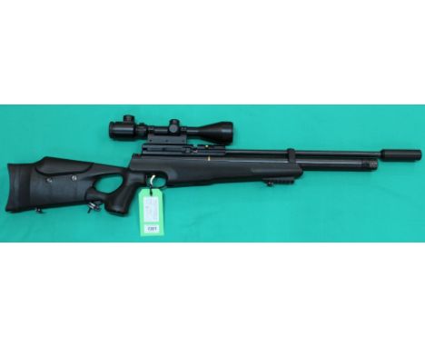 A Hatsan AT 44-10 P.C.P. .177 air rifle complete with pump and 3-9x50 scope, with slip and two magazines, as a post 1939 air 