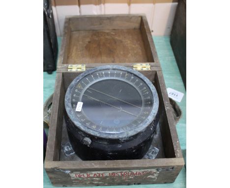 A U.S.A. produced marine compass within a wooden transit box