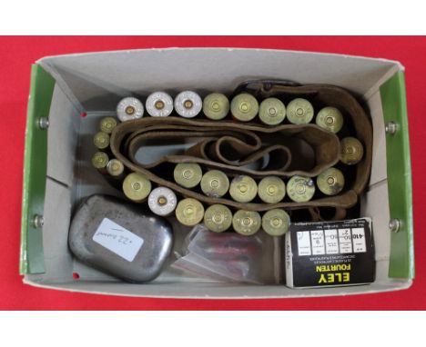 A leather cartridge belt with various shotgun cartridges including .410 2" and a tin of .22 blanks, this item can only be pur