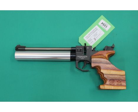 A Rohm 'Twinmaster' P.C.P. 177 cal R/H air pistol, in overall excellent cosmetic condition, with hard case and accessories in