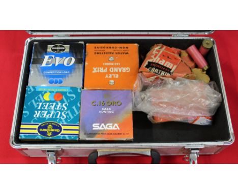 An aluminium carry case containing various shotgun cartridges, this item can only be purchased by someone with a current vali