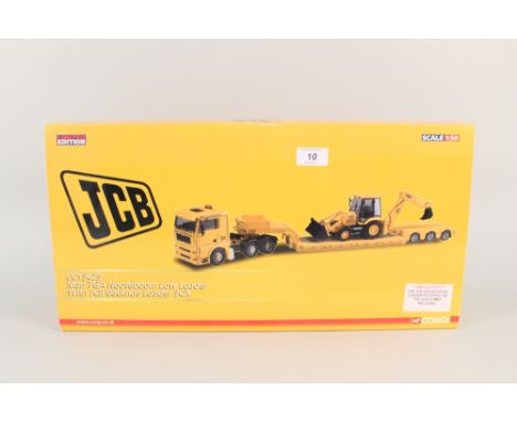 A boxed Corgi Man TGA Nooteboom low loader and JCB backhoe loader 3CX