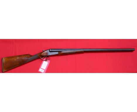 A 12 bore S/S B/L/N/E shotgun by Baikal, S/No.B10994, this item can only be purchased by someone with a current valid shotgun