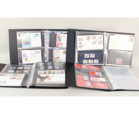 Four albums of first day covers and stamps including Jersey and Isle of Man