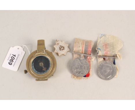 A WWI (dated 1915) brass compass with two WWII medals and an Army Service Corps sweetheart brooch