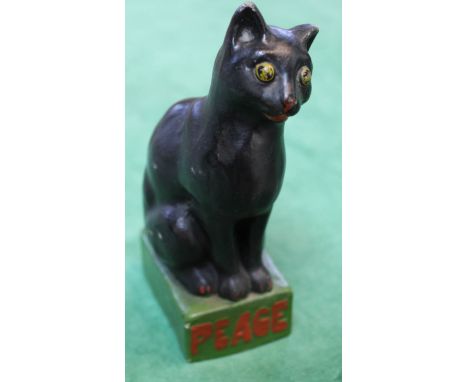 A black ceramic cat, with base marked Peace 1919