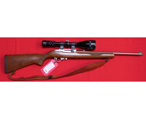 A Ruger model 1022 .22 rim fire self-loading rifle, with leather sling and a Nikko Stirling 4-12x50 scope, S/No. 246-80053 (N