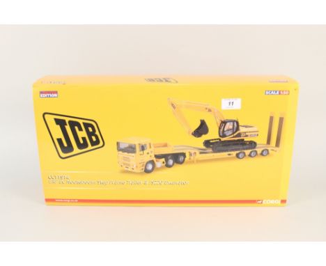 A boxed Corgi ERF E C Nooteboom step frame trailer and JCS JS220 excavator
