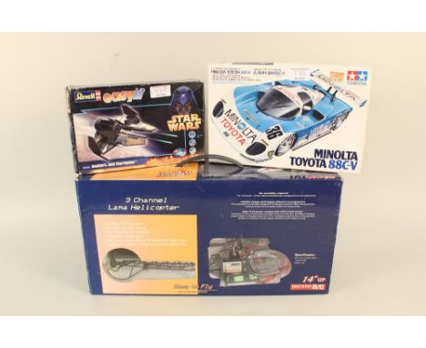 A radio control helicopter and two model kits