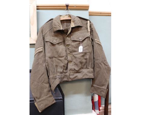 A 1940 patt battledress blouse with insignia for 9th Lancers