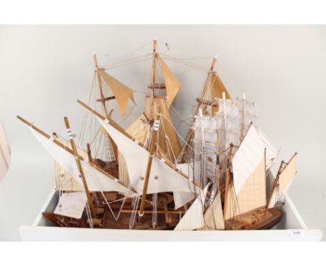 Five various wooden model boats