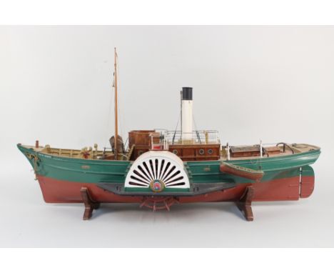 A wooden model paddle boat, length 34"