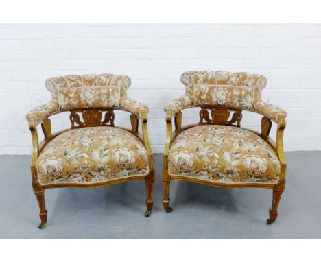 A pair of mahogany and inlaid open armchairs with tapestry upholstered backs, arms and seats with inlaid foliate and carved s