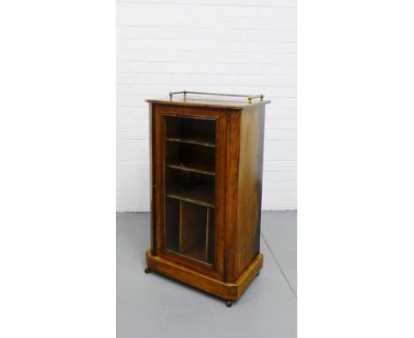 A 19th century rosewood and inlaid music cabinet, the rectangular top with a brass gallery over a glazed cupboard door reveal