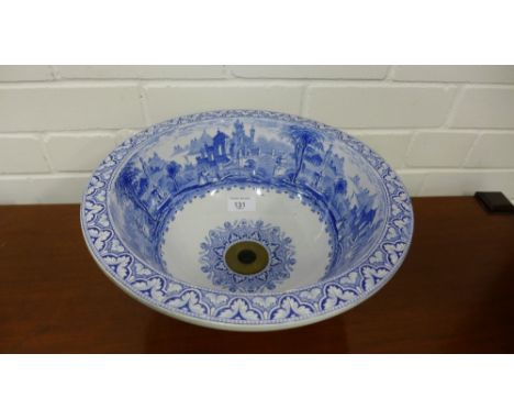 A blue and white transfer printed wash hand basin depicting figures in a classical landscape, 32cm diameter