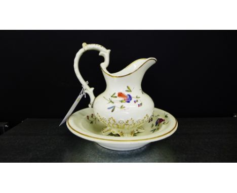 A 19th century floral decorated basin and ewer (2) 