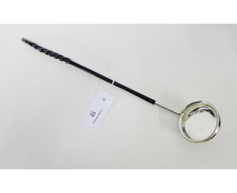 An unmarked white metal toddy ladle with crested bowl and twisted baleen handle 41cm long 