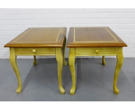 A pair of contemporary lamp tables the rectangular moulded tops over a single drawer to side raised on cabriole supports, 55c