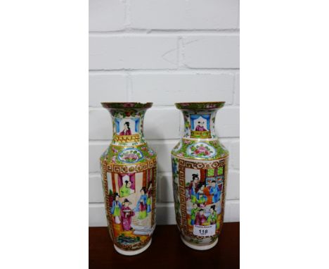 A pair of Canton enamel Famille Rose vases (damages), 26cm high (2) 