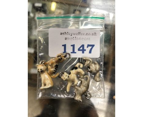 FIVE MINIATURE CERAMIC CAT CHARMS 