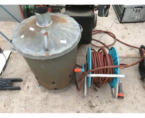 A HOSE PIPE ON A REEL AND A BRASIER 