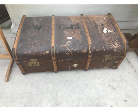 A VINTAGE WOODEN BOUND TRAVEL TRUNK 