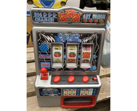 A RETRO TOY 'FRUIT MACHINE' SLOTS GAME WITH GAME TOKENS 