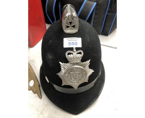 A VINTAGE POLICEMANS HELMET 