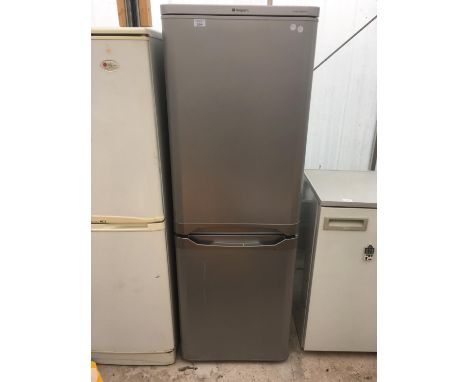 A SILVER HOTPOINT FIRST EDITION FRIDGE FREEZER IN WORKING ORDER 