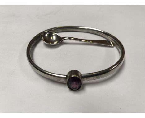A LADIES SILVER BANGLE AND SPOON (2) 