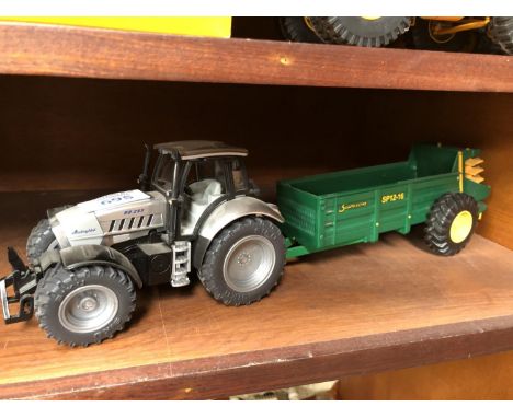 A 'SIKU' MODEL R8 265 LAMBORGINI TRACTOR MODEL WITH A SAMSON SP12-16 'BRITAINS' MUCK SPREADER, BOTH UNBOXED 