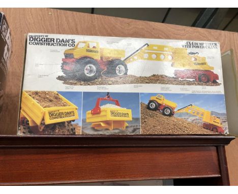 A VINTAGE BOXED  'DIGGER DANS ' CONSTRUCTION CO DUMP TRUCK 