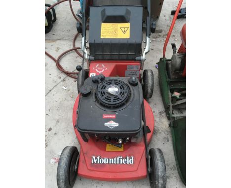 A MOUNTFIELD MIRAGE LAWNMOWER WITH A BRIGGS AND STRATTON ENGINE 