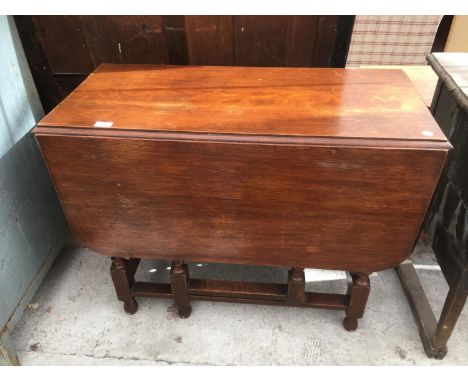 A BARLEY TWIST GATE LEG TABLE 