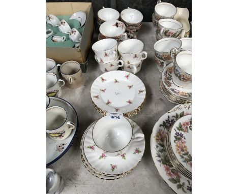 A SET OF ROYAL STAFFORD BONE CHINA TEA CUPS AND SAUCERS WITH SIDE PLATES 